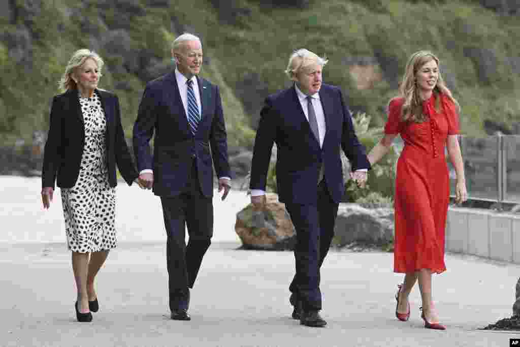 Britain's Prime Minister Boris Johnson, his wife Carrie Johnson and U.S. President Joe Biden with first lady Jill Biden walk outside Carbis Bay Hotel, Carbis Bay, Cornwall, Britain, ahead of the G7 summit.
