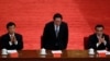 2012年5月周永康（中）、李克强和刘云山（左）在庆祝中国共青团成立90周年大会上被一一介绍。