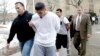 FILE - In this Jan. 11, 2018, photo, suspected members of the MS-13 gang are escorted to their arraignment in Mineola, N.Y.
