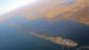 The island village of Kivalina, which the White House chose to highlight as a community at risk from rising sea levels, can be seen from Air Force One as U.S. President Barack Obama flies to Kotzebue, Alaska, Sept. 2, 2015.