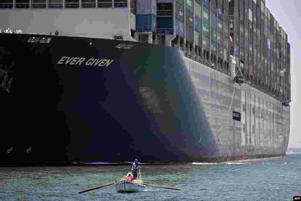 A view of the Panama-flagged MV 'Ever Given' container ship sailing along Egypt's Suez Canal near the canal's central city of Ismailia.