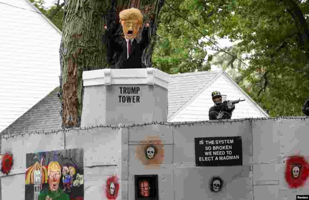 A Halloween display featuring a border wall and figures of Donald Trump, Hillary Clinton and Bernie Sanders is seen on the property of Matt Warshauer in West Hartford, Connecticut, Oct. 4, 2016.