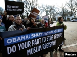 FILE - Members of Join MoveOn and DRUM march past the White House during a protest to shut down the existing Muslim registry program NSEERS in Washington, Dec. 12, 2016.