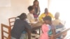 Mercer University medical students register patients (VOA/L. Masina) 