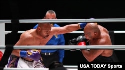 Mike Tyson, right, fights Roy Jones Jr. during a heavyweight exhibition boxing bout for the WBC Frontline Belt at the Staples Center on Nov. 28, 2020. (Photo: Joe Scarnici/Handout Photo via USA TODAY Sports)