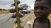 A boy displays boiled rats for sale on the main highway in Malawi's capital Lilongwe June 20, 2009.