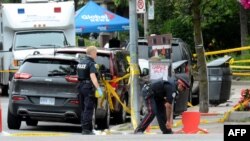 Toronto Police investigate the scene of a shooting from the night before in Toronto, Ontario, Canada on July 23, 2018.