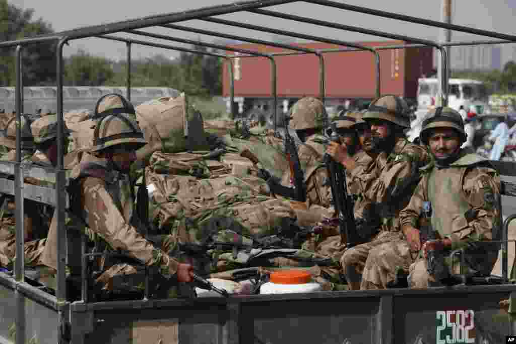 Army troops leave Karachi, Pakistan heading for an earthquake-affected area in the Baluchistan province, Sept. 25, 2013. 