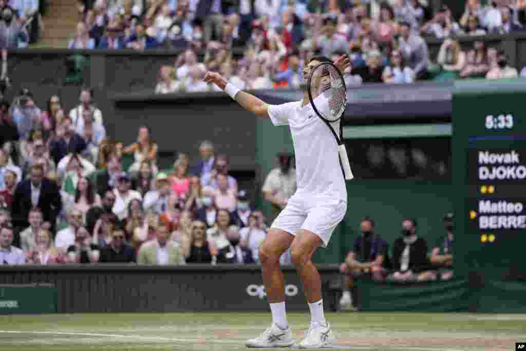 Serbia's Novak Djokovic celebrates after defeating Italy's Matteo Berrettini in the men's singles final on day thirteen of the Wimbledon Tennis Championships in London.