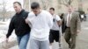 Suspected members of the MS-13 gang are escorted to their arraignment in Mineola, New York, Jan. 11, 2018.