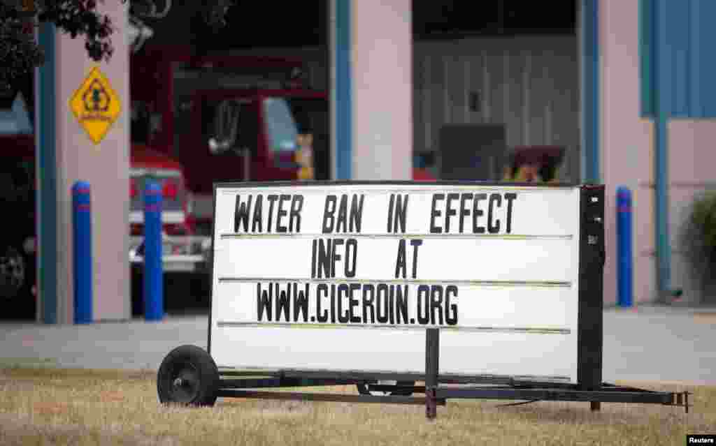 A sign at the fire department reminds people of the mandatory water usage ban as water levels drop in Cicero, Indiana July 19, 2012.