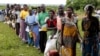 Malawians queue for food aid distributed by the United Nations World Food Program (WFP) in Mzumazi village near the capital Lilongwe, Feb. 3, 2016. 