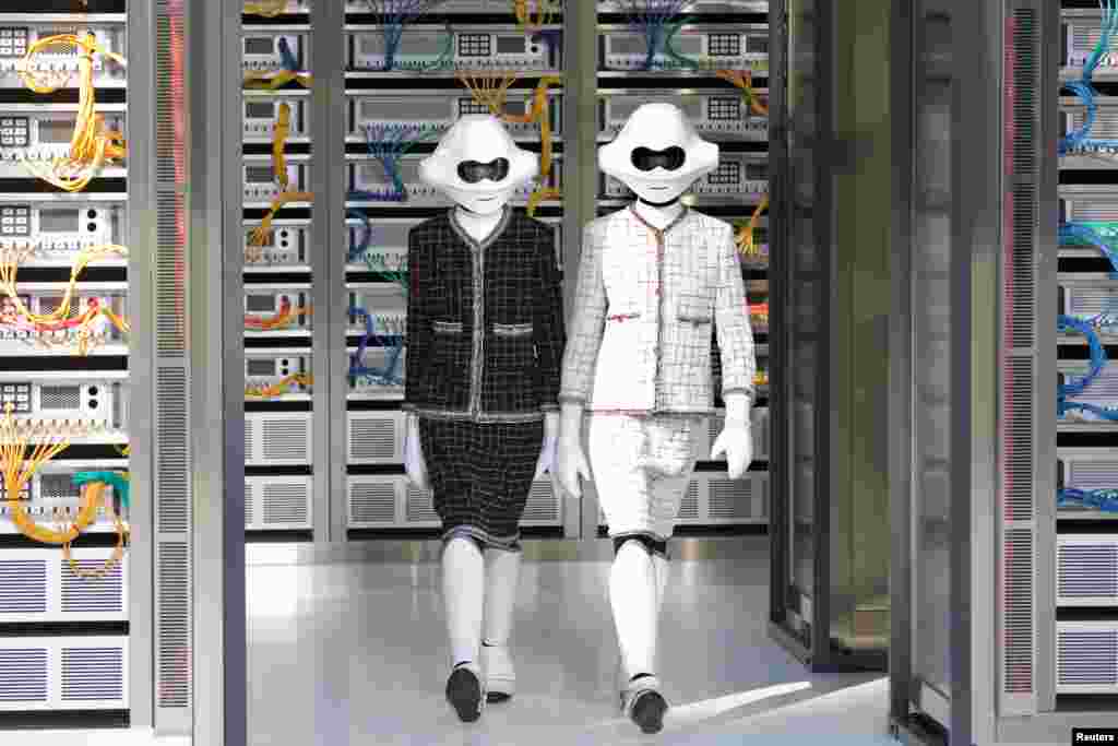 Models present creations by German designer Karl Lagerfeld as part of his Spring/Summer 2017 women's ready-to-wear collection for fashion house Chanel during Fashion Week in Paris, France.