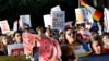 FILE - Protesters march through downtown Phoenix, May 1, 2017. Immigrant and union groups marched in cities across the United States on Monday to mark May Day and protest against President Donald Trump's efforts to boost deportations. 