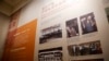 FILE - A display board showing photos of criminals receiving their death sentences by Chinese's courts on display at the China Court Museum in Beijing, Apr. 11, 2017.