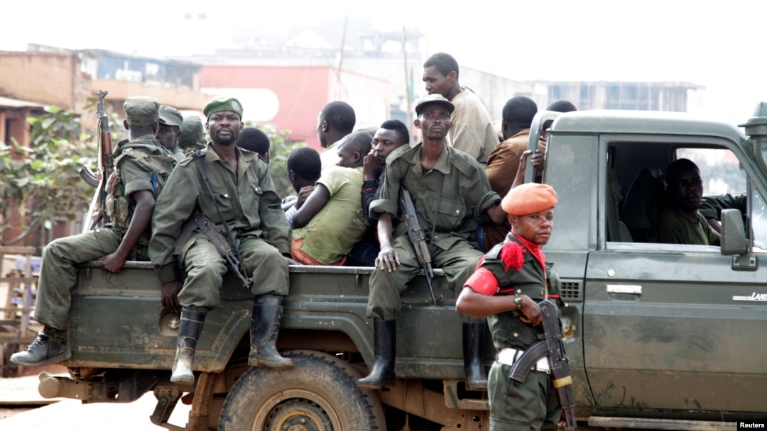 FILE - Congolese soldiers are seen on a pick-up truck after dispersing civilians protesting against what they say is the government's failure to stop killings and inter-ethnic tensions in the town of Butembo, North Kivu province, DRC, Aug. 24, 2016.