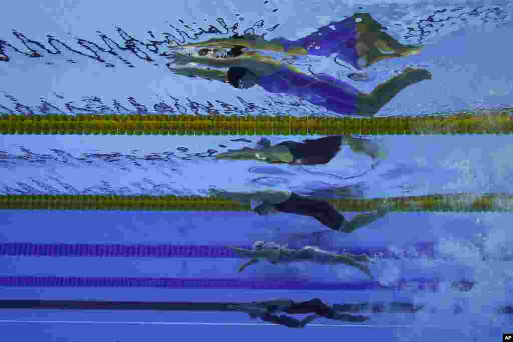 Perenang-perenang dari atas ke bawah; Perenang Uzbekistan Shokhsanamkhon Toshpulatova, perenang Ukraina Anna Stetsenko, perenang Polandia Joanna Mendak, perenang Uzbekistan Muslima Odilova dan Fotimakhon Amilova bertanding dalam nomor 100 m Gaya Bebas Wanita di Pertandingan Paralympic di Rio de Janeiro, Brazil.