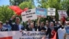 FILE - Supporters of Turkish President Recep Tayyip Erdogan react to anti-Erdogan supporters outside the White House in Washington, D.C., May 16, 2017. Erdogan was meeting with U.S. President Donald Trump.