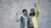 FILE - Iranian journalists Niloofar Hamedi, right, and Elaheh Mohammadi flash the victory sign after being released from prison on Jan. 14, 2024, in Tehran, having been released on bail pending an appeal. Iran's courts announced on Feb. 11, 2025, that the two have been pardoned.