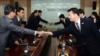 10일 개성공단 종합지원센터에서 열린 개성공단 남북공동위원회 2차 회의에서 남북대표단이 회담에 앞서 악수하고 있다.