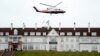 FILE - Then-presidential candidate Donald Trump leaves by his helicopter from the Turnberry golf course in Turnberry, Scotland, Aug. 1, 2015.