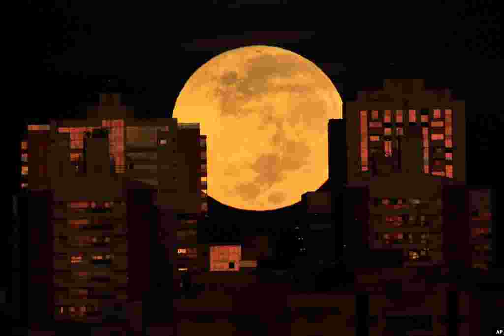 A lunar eclipse is observed during dawn in Brasilia, Brazil.