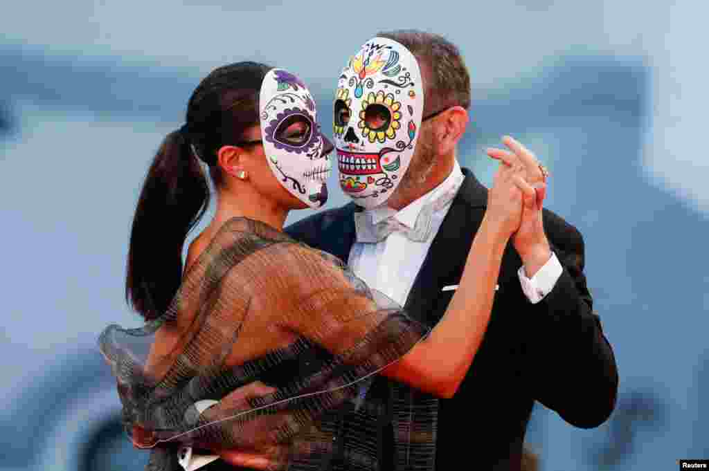 Actor Hernan Mendoza and his partner Alejandra Briceno pose during the screening of the film "The Box" at the 78th Venice Film Festival in Venice, Italy, Sept. 6, 2021.