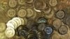 FILE - Bitcoin tokens at 35-year-old software engineer Mike Caldwell's shop in Sandy, Utah, April 3, 2013. 